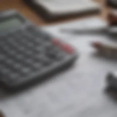 Close-up of a financial calculator and mortgage documents